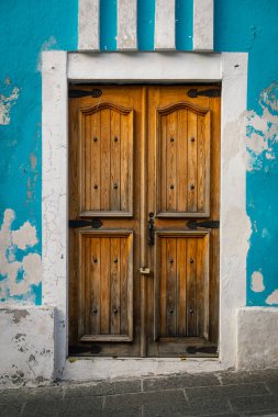 wooden door with padlock in a colonial house in Puebla