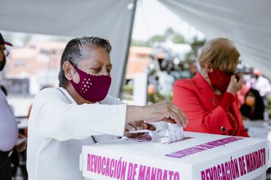 Citizens go to the polls to vote in the Citizen Consultation for the Removal of the Mandate of the President of Mexico, Andres Manuel Lopez Obrador (AMLO) clipart