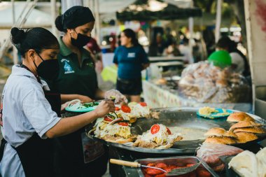 Poblano cemitas stand in a market