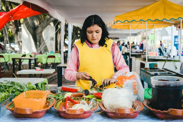 Poblano cemitas stand in a market