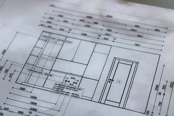 Detail of the kitchen design paper with dimensions and connection to water and waste pipe and electricity.