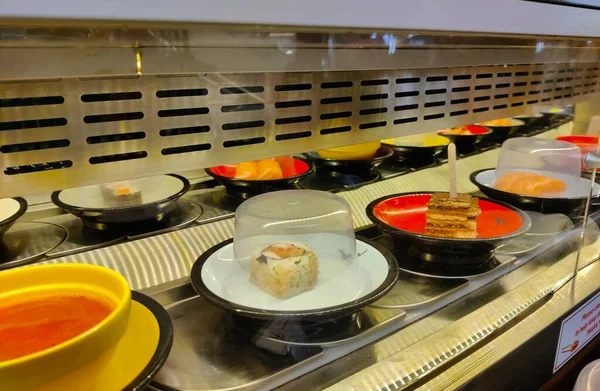 Close View Running Sushi Trail Lot Small Dishes Running Back — Stock Photo, Image