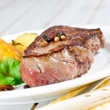 Steak with potatoes clipart