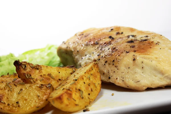 Chicken with potato wedges — Stock Photo, Image