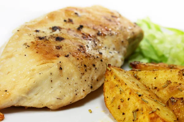 Chicken with potato wedges — Stock Photo, Image