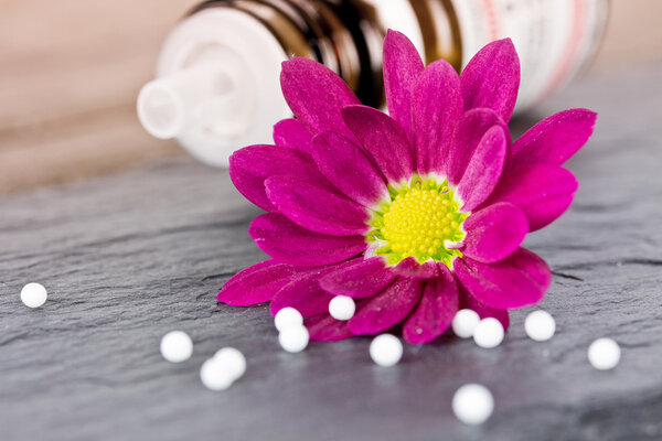 Globuli with pink flower