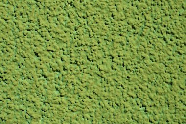 Sert yeşil alçılı yüzey. Doku yüzey duvarı arkaplanı
