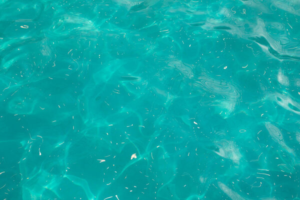 Water surface texture, light blue clear water in the pool, textured effect background for design