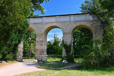 Old aqueduct - Lednice - South Moravia - Czech Republic. A beautiful park with a lake in the castle grounds. Landscape with nature in summer time.
