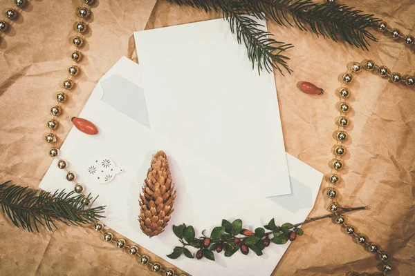 Christmas mockup for postcard with dry fruits, craft paper, gift box, handmade christmas toys