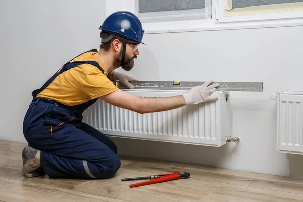 Worker Orange Helmet Installs Radiators House — Stock Photo, Image