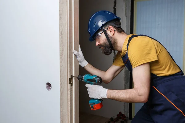 Worker Drill Orange Helmet Installs Door House — Stock Photo, Image