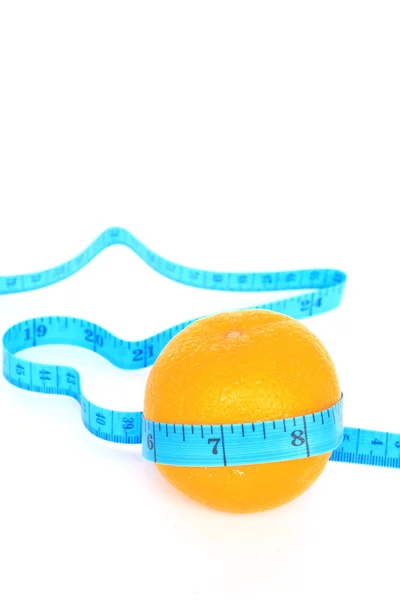 Orange wrapped with measuring tape — Stock Photo, Image