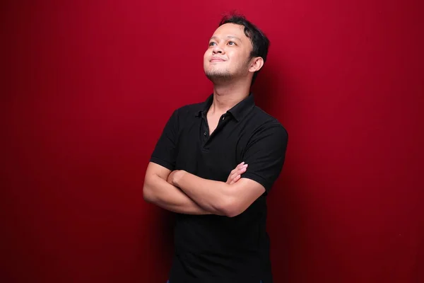 Portrait Smiling Young Asian Man Wearing Black Shirt Isolated Red — Stok Foto