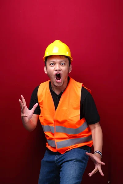 Wow and shocked face of Young Asian man with open hand gesture. Advertising model concept.