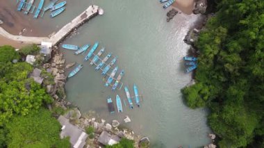 Aerial view of traditional boats in lagoon beach in Indonesia