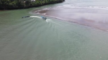 Aerial view of traditional boats in lagoon beach in Indonesia