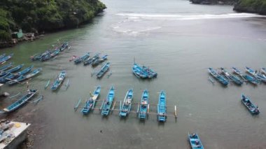 Aerial view of traditional boats in lagoon beach in Indonesia