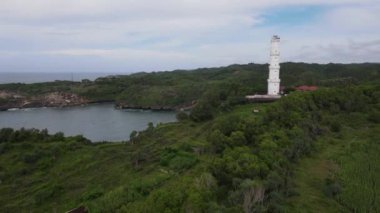 Aerial view of the lighthouse in Indonesian beach