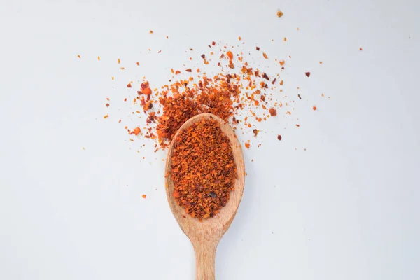 Red Chili Flakes Wooden Spoon White Background — Foto Stock