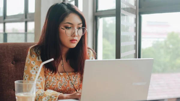 Young Asian Woman Working Laptop Computer While Sitting Cafe Looking — Stock Photo, Image