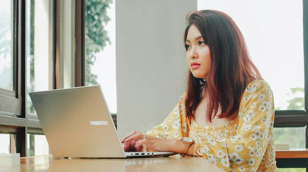 Young Asian Woman Working Laptop Computer While Sitting Cafe Looking — Stock Photo, Image