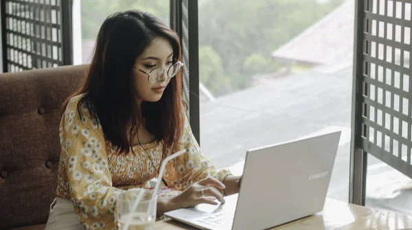 Young Asian Woman Working Laptop Computer While Sitting Cafe Looking — Stock Photo, Image