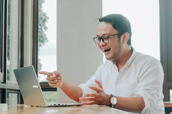 Young Asian Businessman Smiling While Working Laptop Computer Home Office Stok Gambar Bebas Royalti