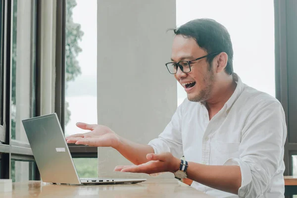 Young Asian Businessman Smiling While Working Laptop Computer Home Office Stok Gambar Bebas Royalti