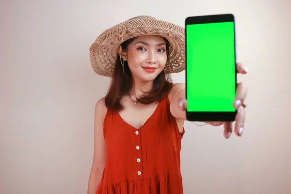 Excited Smiling Young Asian Woman Showing Green Screen Smartphone Her — стокове фото