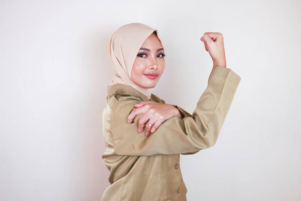 Gorgeous Strong Young Muslim Asian Woman Wearing Brown Uniform Showing Royalty Free Stock Images