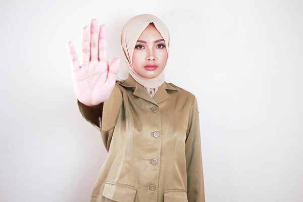 Young Asian Muslim Woman Wearing Brown Uniform Hijab Shows Her Stock Photo