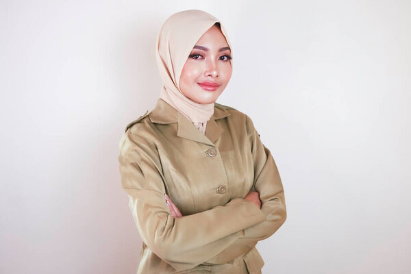 Portrait Young Asian Muslim Woman Wearing Brown Uniform Hijab Smiling Royalty Free Stock Photos