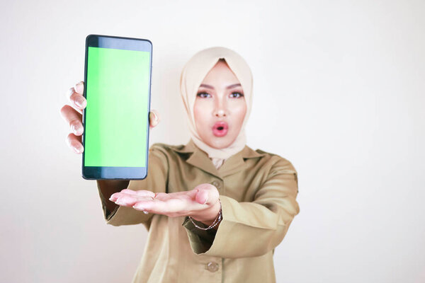 Shocked Asian Woman Wearing Brown Uniform Pointing Finger Green Screen Stock Image