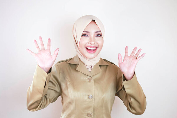 Moslem Civil Worker Wearing Brown Uniform Hijab Greeting Hand Gesture Stock Picture