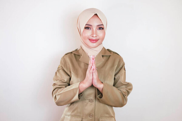 Moslem Civil Worker Wearing Brown Uniform Hijab Greeting Hand Gesture Royalty Free Stock Images