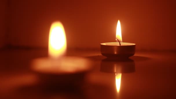 Two Candles Light Burning Brightly Black Background — Vídeos de Stock