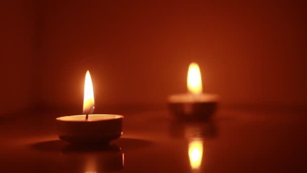 Two Candles Light Burning Brightly Black Background — Vídeo de stock