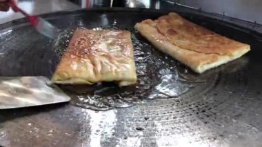 The process of making or cooking an Martabak Telur or Martabak Eggs, Indonesian street food. 