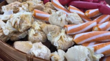 Various topping for suki and tomyam in steam bowl