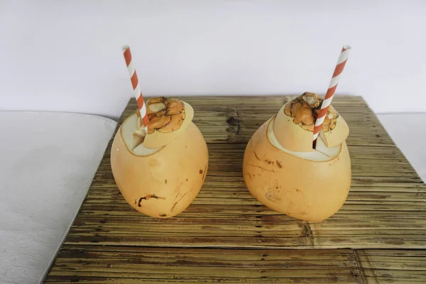 Two Coconut Juices Paper Straws Placed Wooden Table — Φωτογραφία Αρχείου