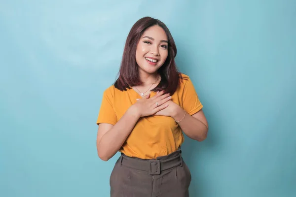 Happy Mindful Thankful Young Woman Holding Hands Chest Smiling Isolated — ストック写真