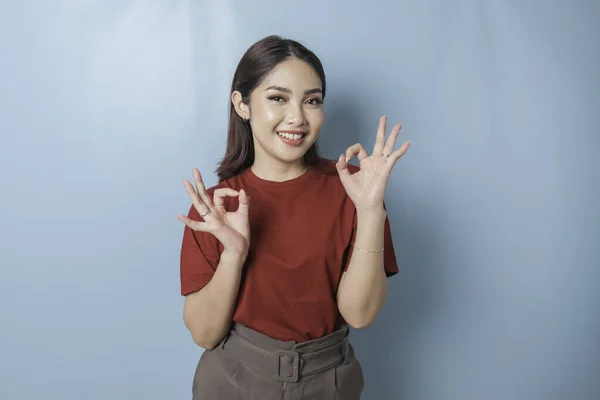 Excited Asian Woman Wearing Red Shirt Giving Hand Gesture Isolated — Stok fotoğraf