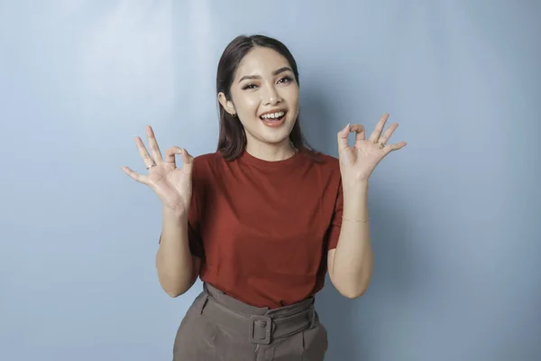 Excited Asian Woman Wearing Red Shirt Giving Hand Gesture Isolated — ストック写真