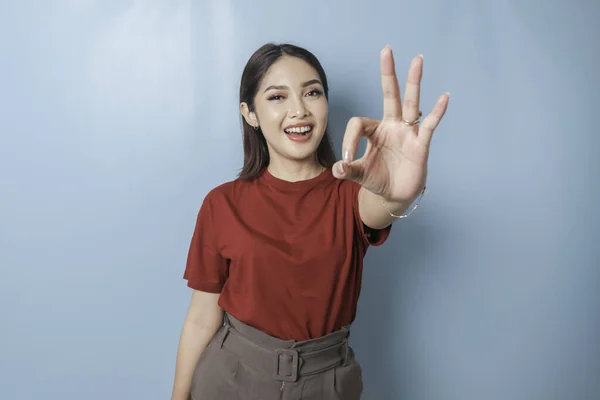 Excited Asian Woman Wearing Red Shirt Giving Hand Gesture Isolated — Stok fotoğraf