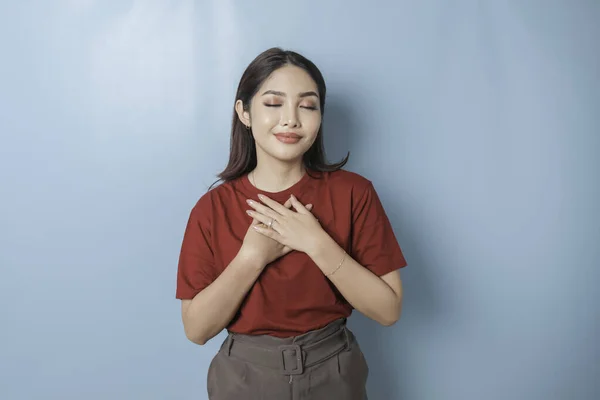 Happy Mindful Thankful Young Woman Holding Hands Chest Smiling Isolated — Fotografia de Stock