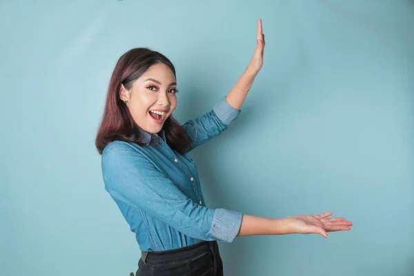 Excited Asian Woman Wearing Blue Shirt Pointing Copy Space Her — ストック写真