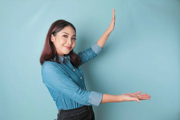 Excited Asian Woman Wearing Blue Shirt Pointing Copy Space Her — ストック写真