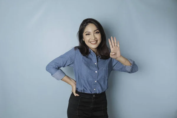 Excited Asian Woman Wearing Blue Shirt Giving Number 12345 Hand —  Fotos de Stock