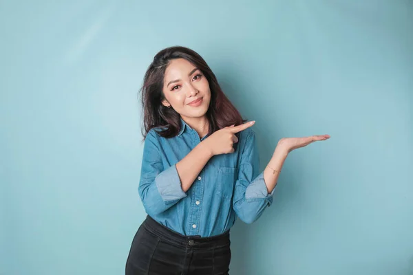 Excited Asian Woman Wearing Blue Shirt Pointing Copy Space Her — Stok fotoğraf